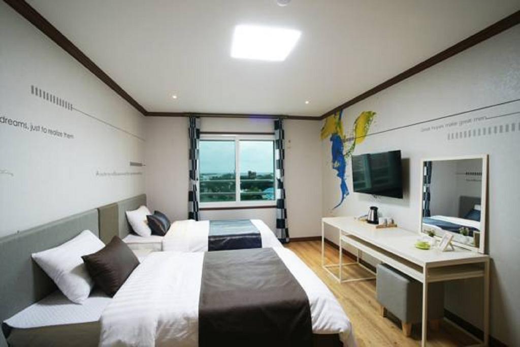 Seongsan Aqua Beach Hotel Seogwipo Quarto foto