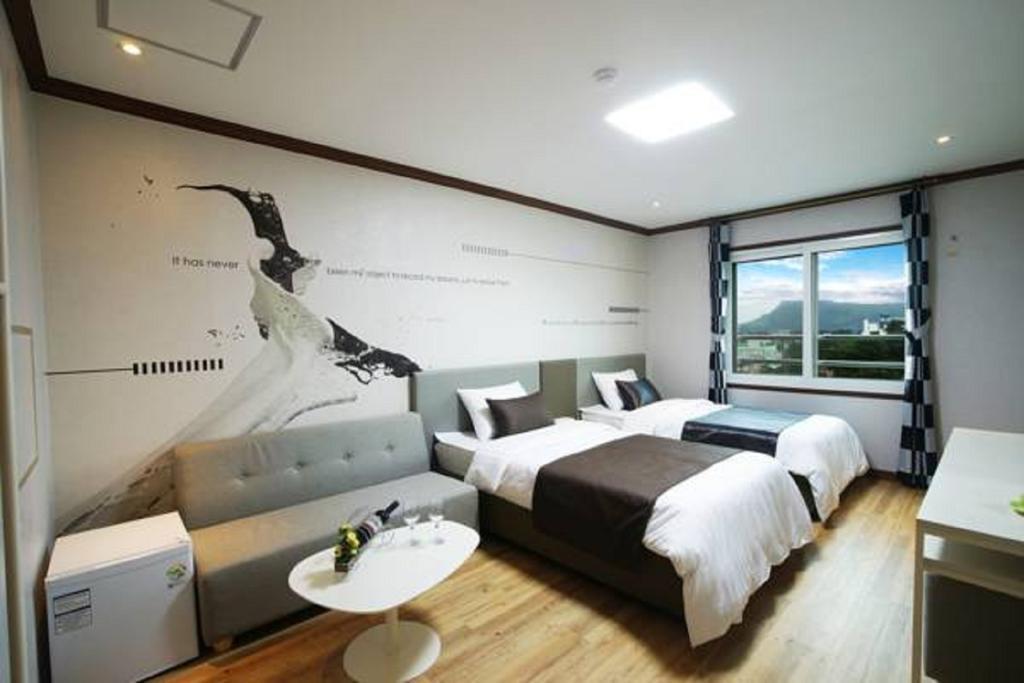 Seongsan Aqua Beach Hotel Seogwipo Quarto foto